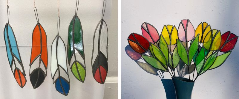 Stained glass feathers and tulips.