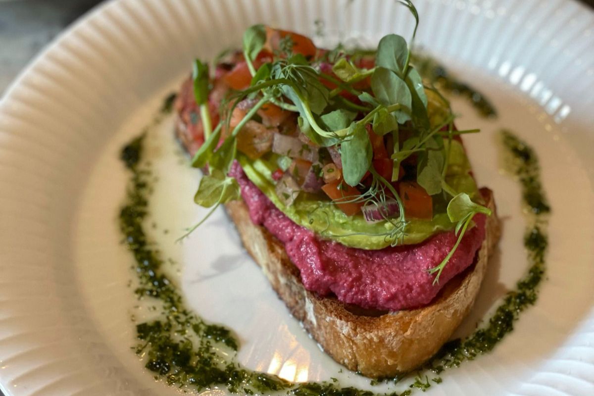 Grilled sourdough topped with beetroot hummus.