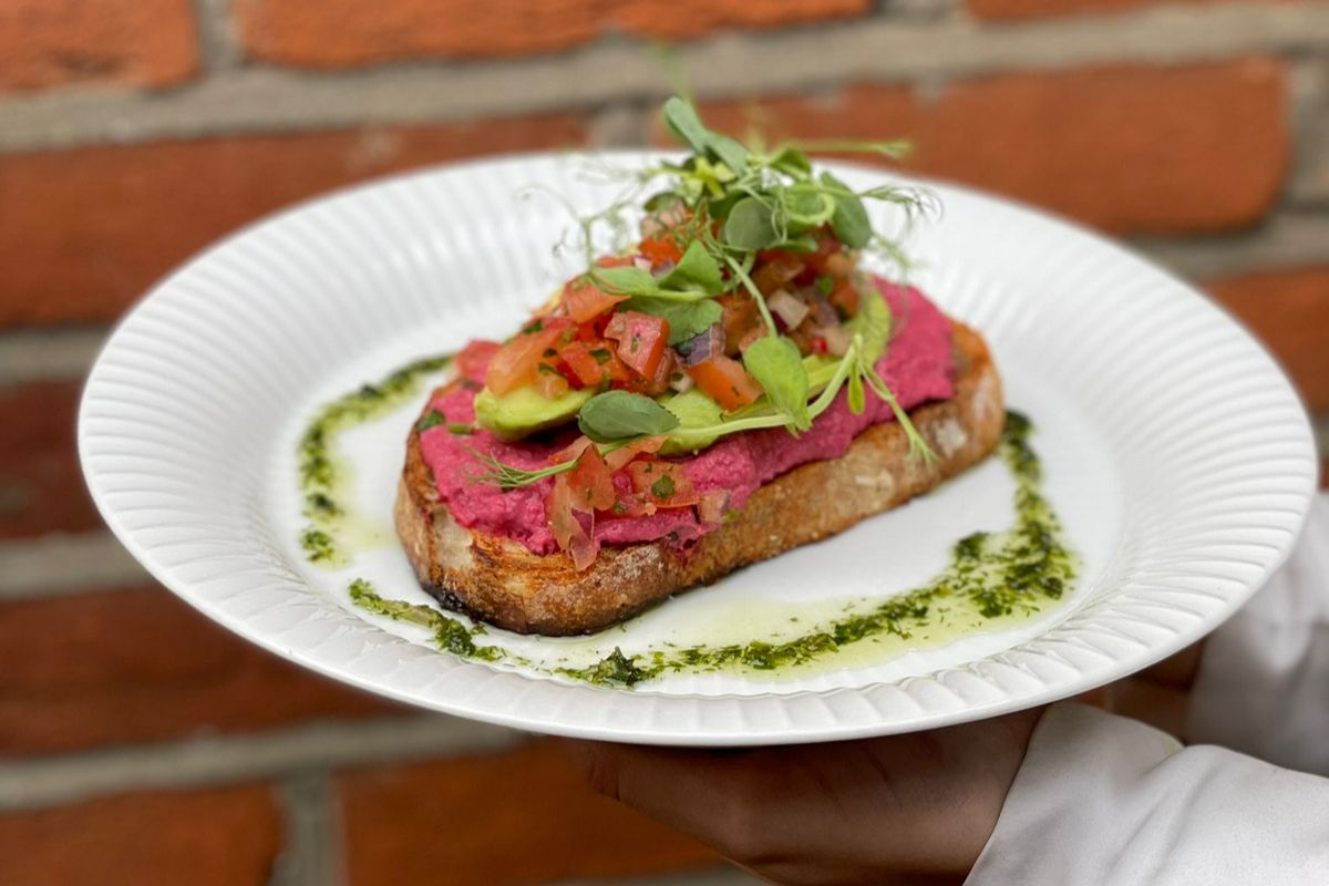 Grilled sourdough topped with beetroot hummus.