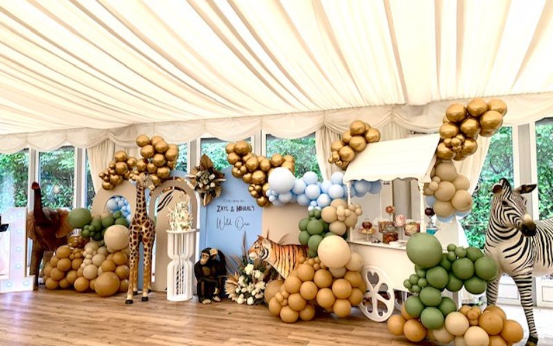 Colourful balloons and animal decorations inside the Grand Pavilion for a child's birthday party.