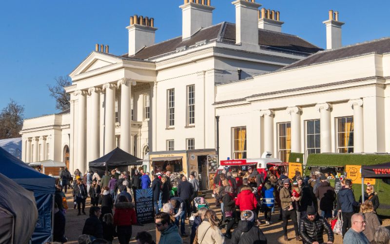 Visitors enjoying the market happening outside Hylands House.