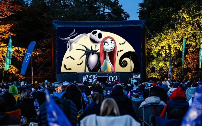 The Nightmare Before Christmas being shown on a large, outdoor screen.