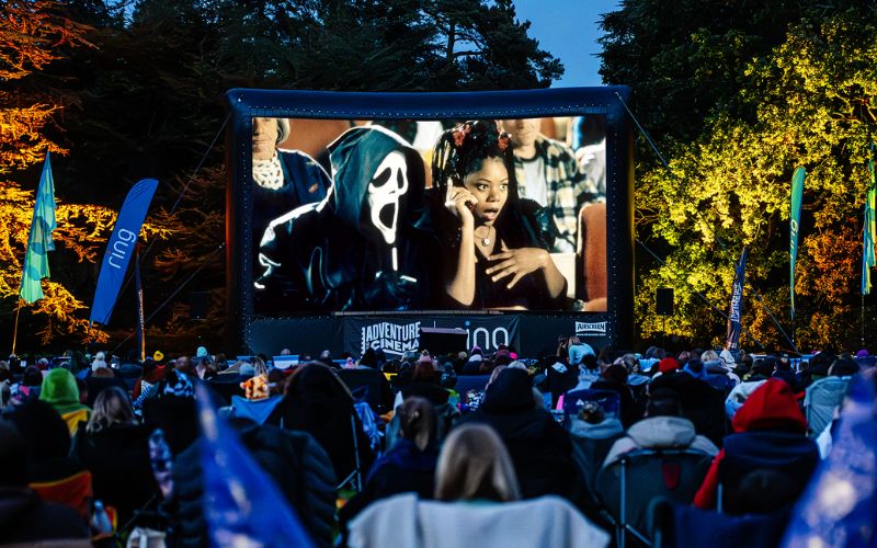 Scary Movie being shown on a large, outdoor screen.